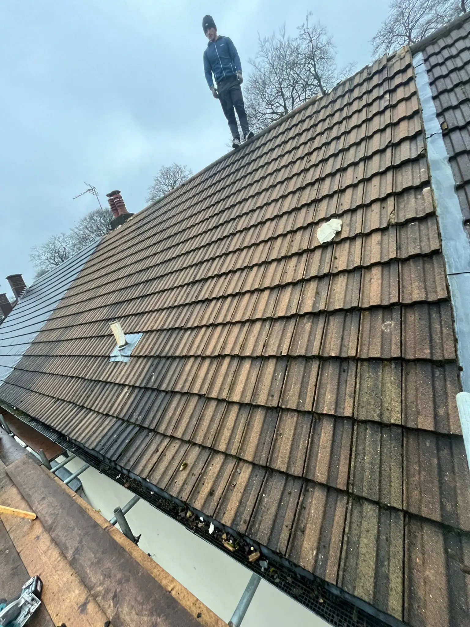 Spray foam being stripped out of a roof in Walters Ash