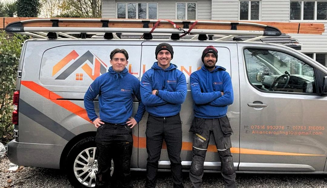 The Alliance Roofing & Building team in front of their branded van